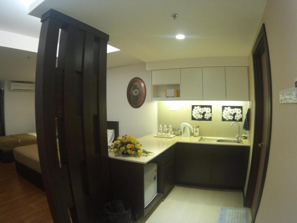 Kuchyň nebo kuchyňský kout v ubytování Cyber Studio Apartment