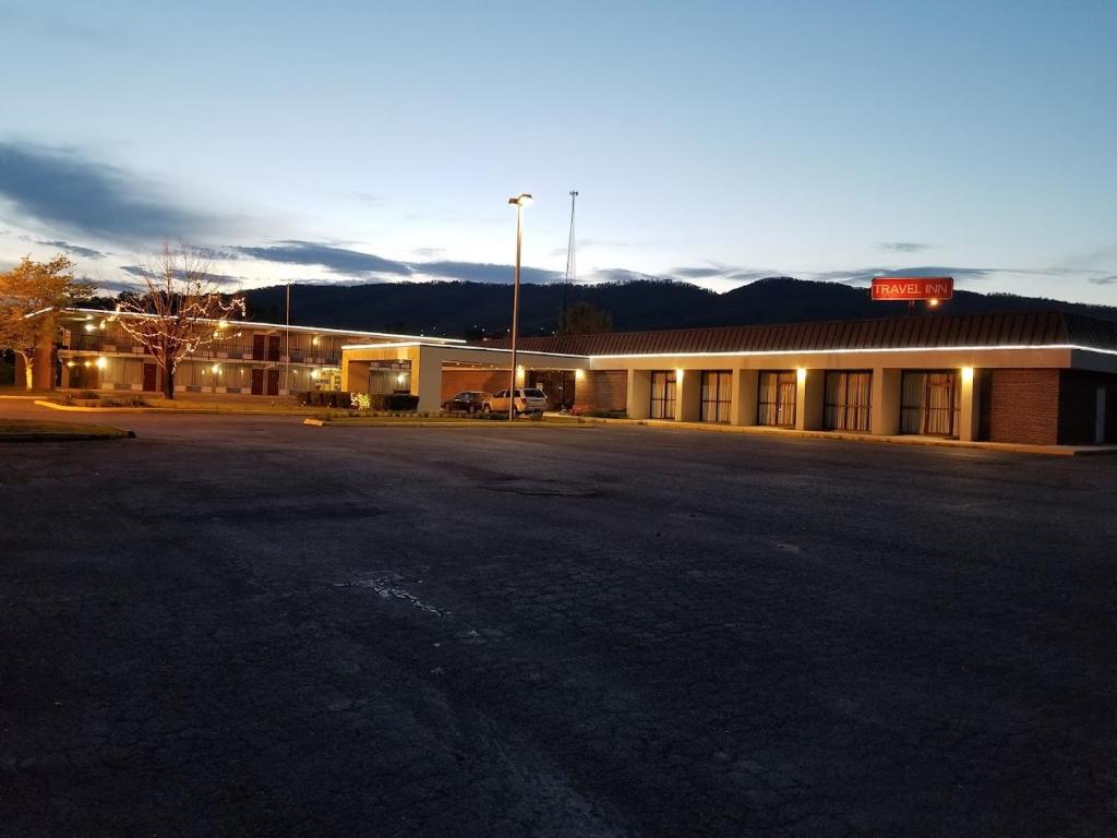 an empty parking lot in front of a building at Travel Inn in Duffield