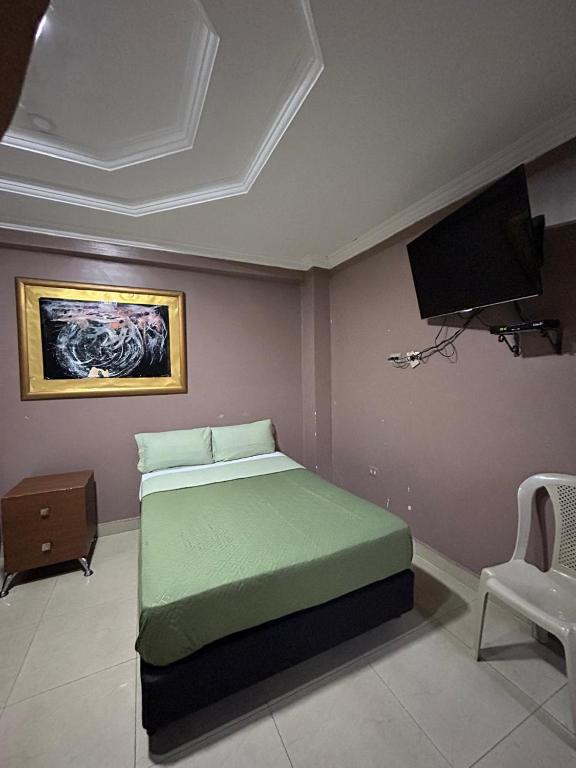 Postel nebo postele na pokoji v ubytování Hotel Caribe