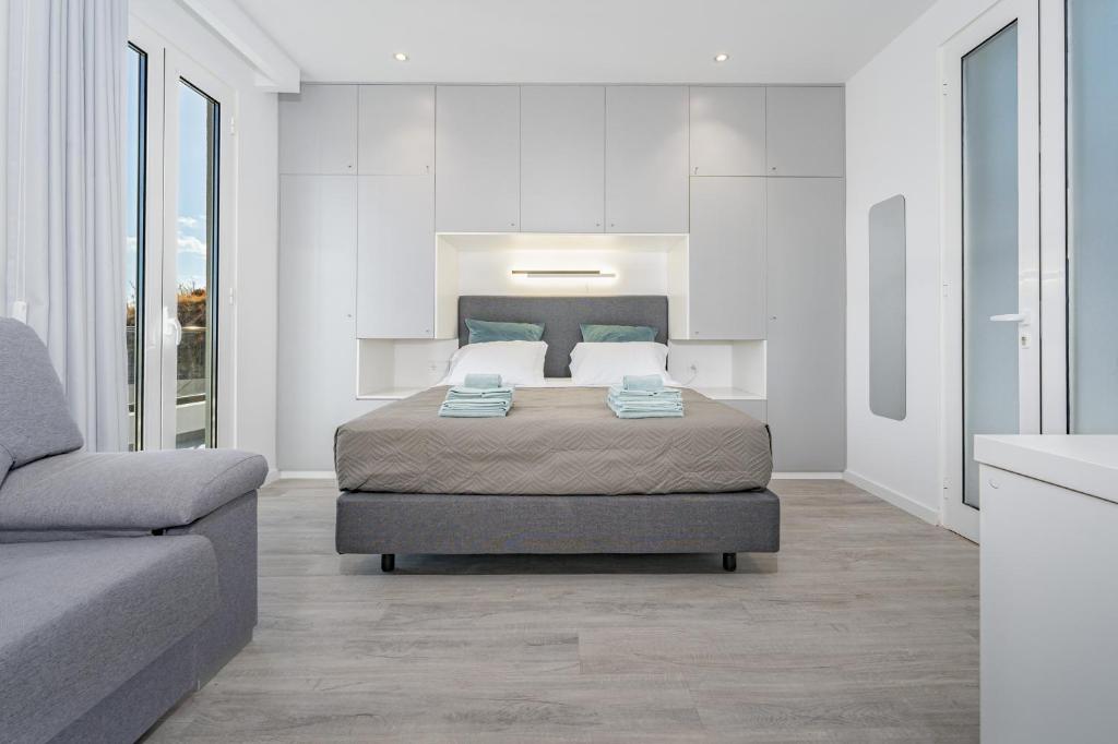 Ένα ή περισσότερα κρεβάτια σε δωμάτιο στο JPL Blue Horizon Residential - Casa Blue B & C