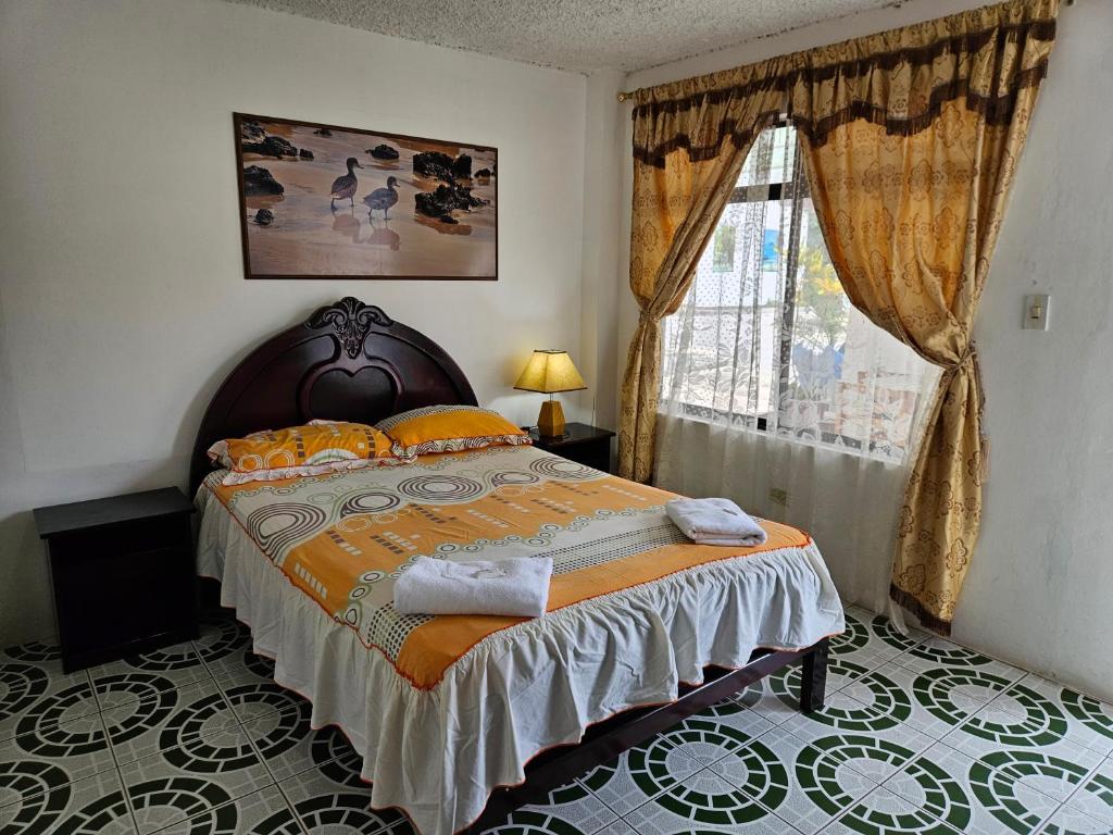 Postel nebo postele na pokoji v ubytování Hostal Cerro Azul