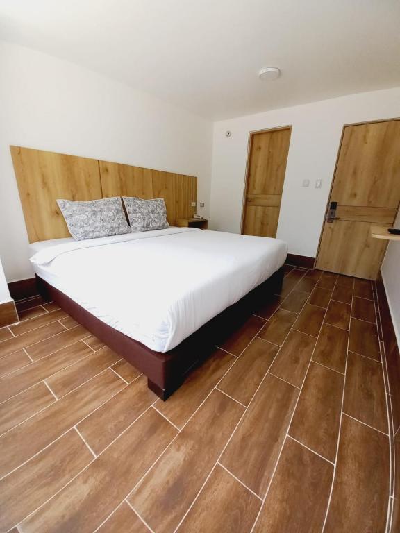 Postel nebo postele na pokoji v ubytování Aw Hotel Ariston Embassy