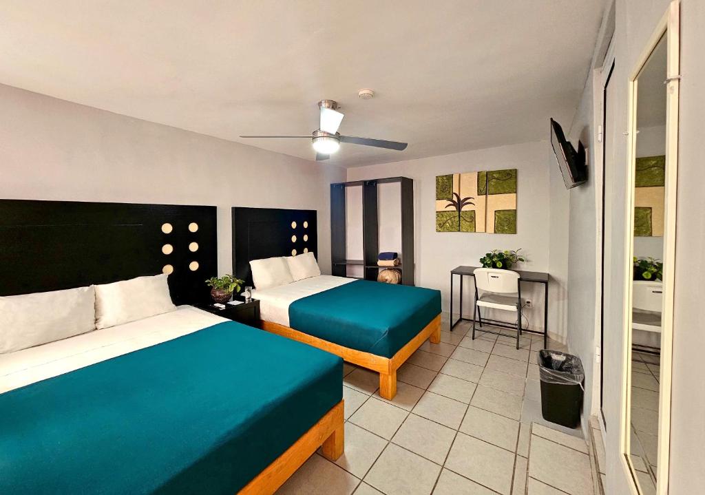 Postel nebo postele na pokoji v ubytování Hotel del Refugio