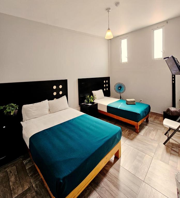 Postel nebo postele na pokoji v ubytování Hotel del Refugio