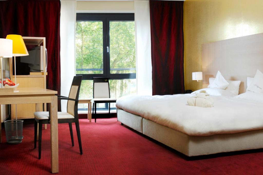 Un ou plusieurs lits dans un hébergement de l'établissement Hotel Schepers