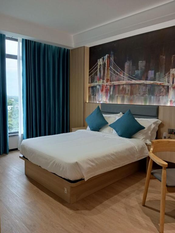 Postel nebo postele na pokoji v ubytování Fan's Hotel Palo