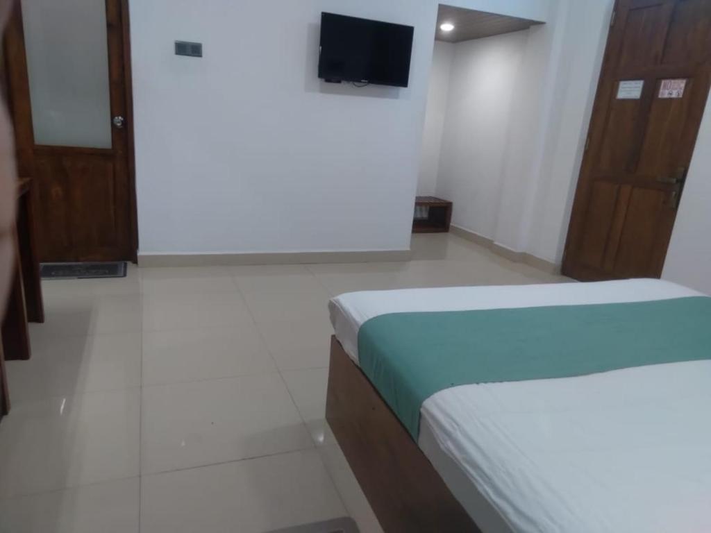 Postel nebo postele na pokoji v ubytování Kudila Resort
