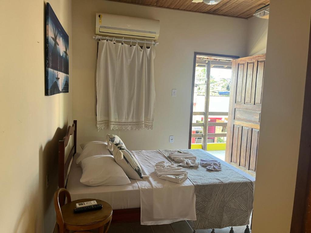 Postel nebo postele na pokoji v ubytování Pousada Passarela da Pituba