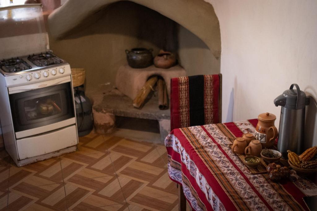 Kuchyň nebo kuchyňský kout v ubytování Sonidos del Ande Wasi