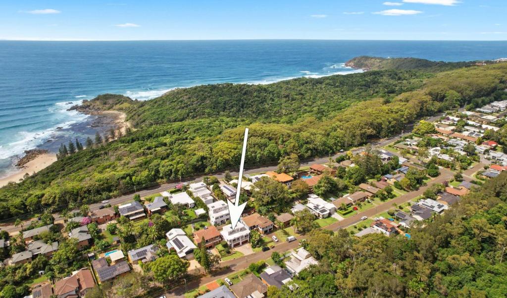an aerial view of a beach with houses and the ocean at Azul Blue at Shellys in Port Macquarie