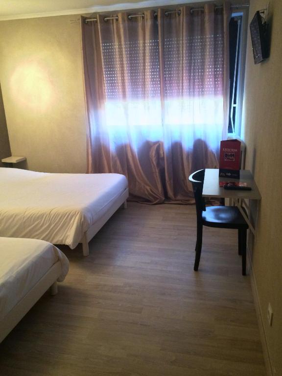 Postel nebo postele na pokoji v ubytování L'Excess Hotel