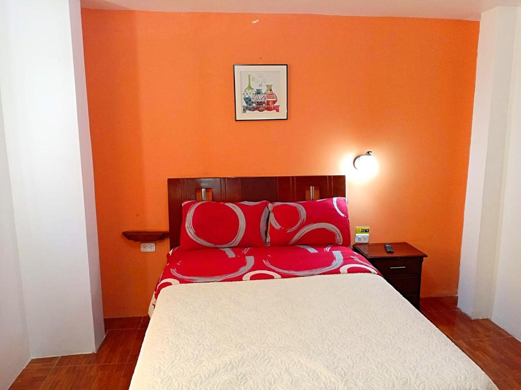 Postel nebo postele na pokoji v ubytování Hostal Mariscal Sucre