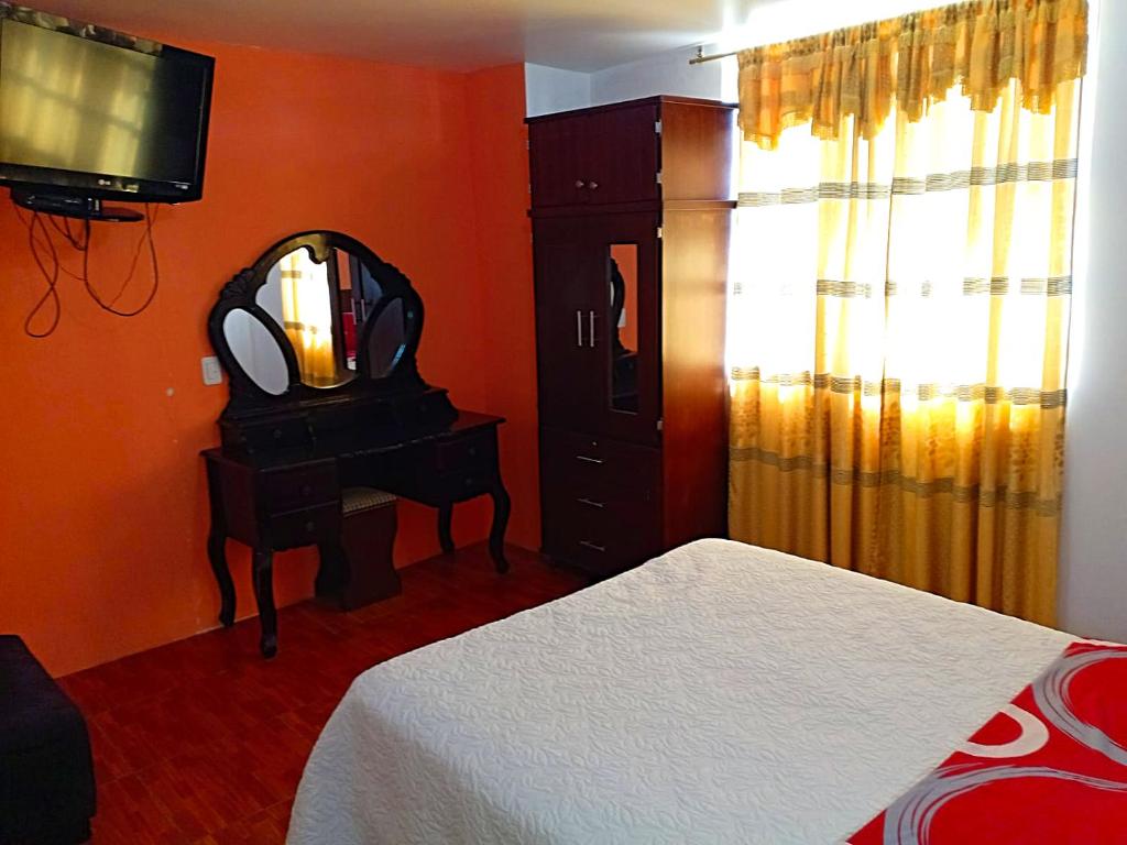 Postel nebo postele na pokoji v ubytování Hostal Mariscal Sucre