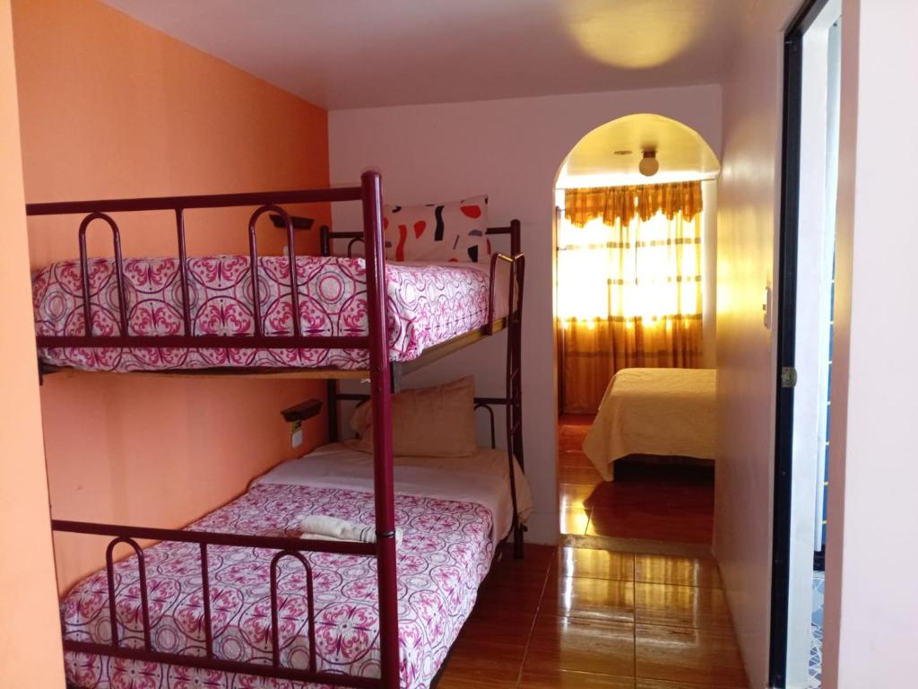 Postel nebo postele na pokoji v ubytování Hostal Mariscal Sucre