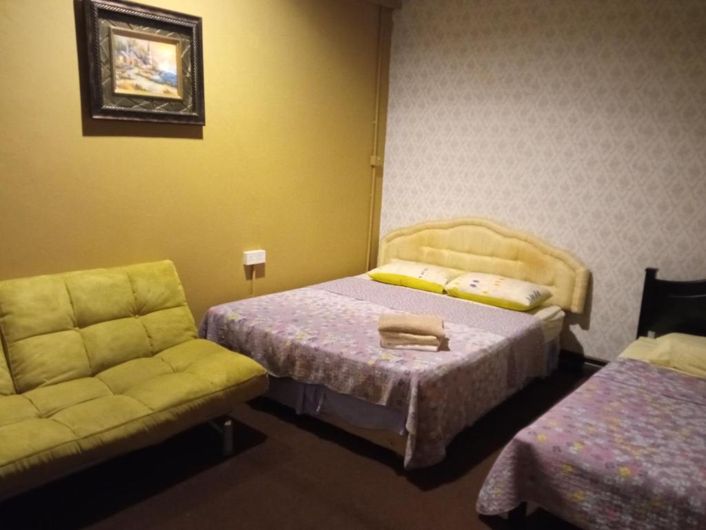 Postel nebo postele na pokoji v ubytování Marco Polo Guest House