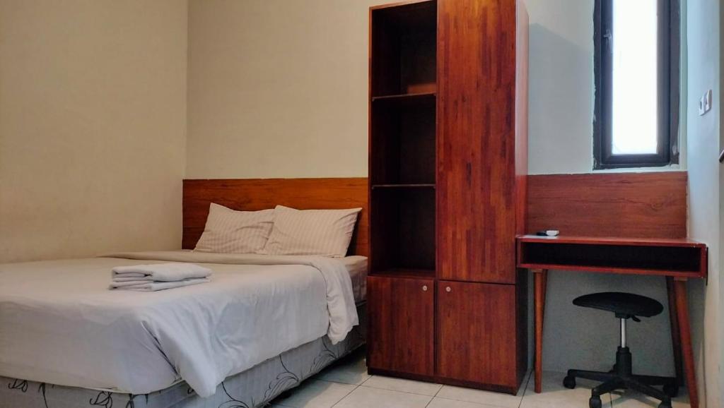 Postel nebo postele na pokoji v ubytování Kozy 15 Guesthouse