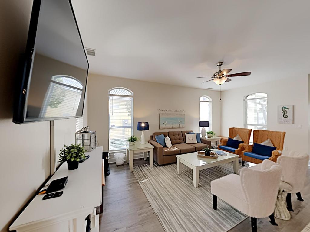 a living room with a couch and a table at Changes In Latitude in Destin