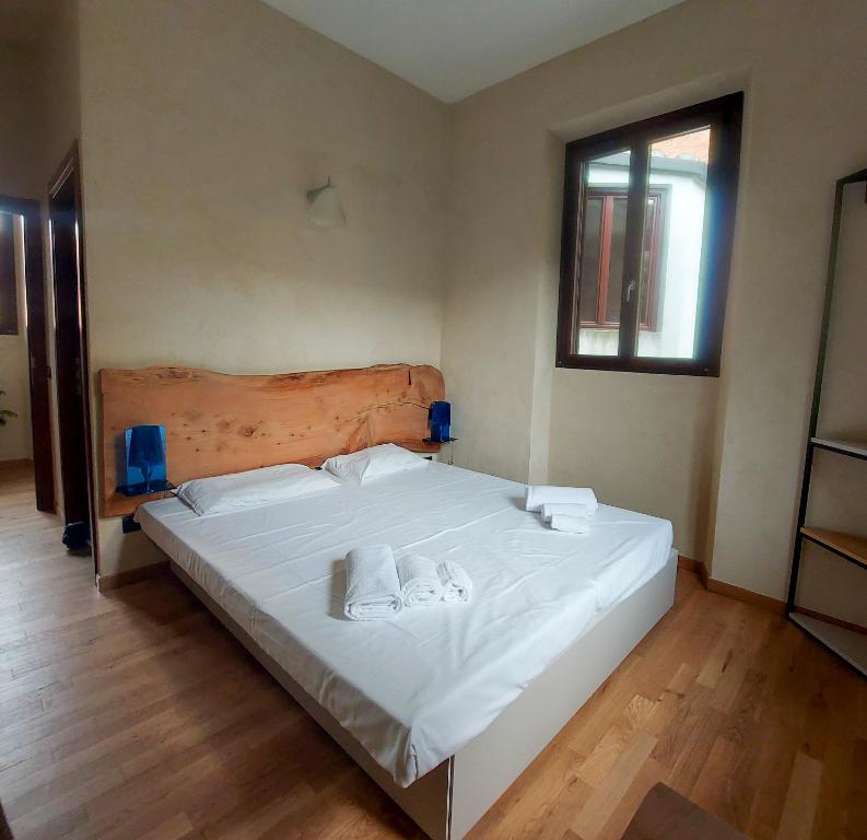 Postel nebo postele na pokoji v ubytování Il Carro Rooms - Monza Centro, Tribunale, Ospedale