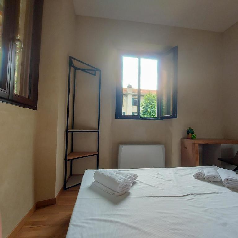 Postel nebo postele na pokoji v ubytování Il Carro Rooms - Monza Centro, Tribunale, Ospedale