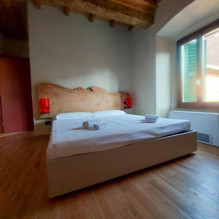 Postel nebo postele na pokoji v ubytování Il Carro Rooms - Monza Centro, Tribunale, Ospedale