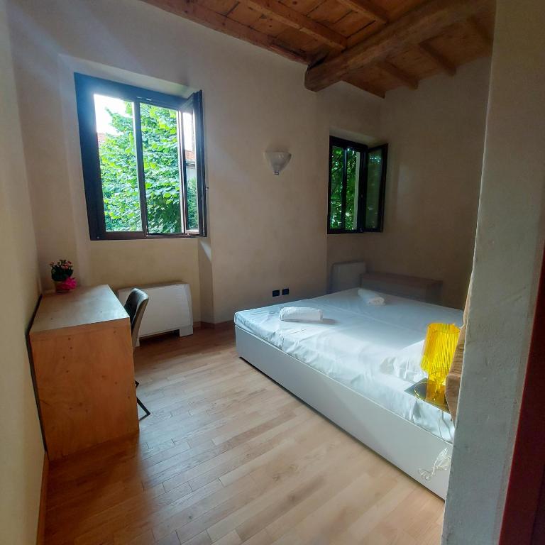Postel nebo postele na pokoji v ubytování Il Carro Rooms - Monza Centro, Tribunale, Ospedale