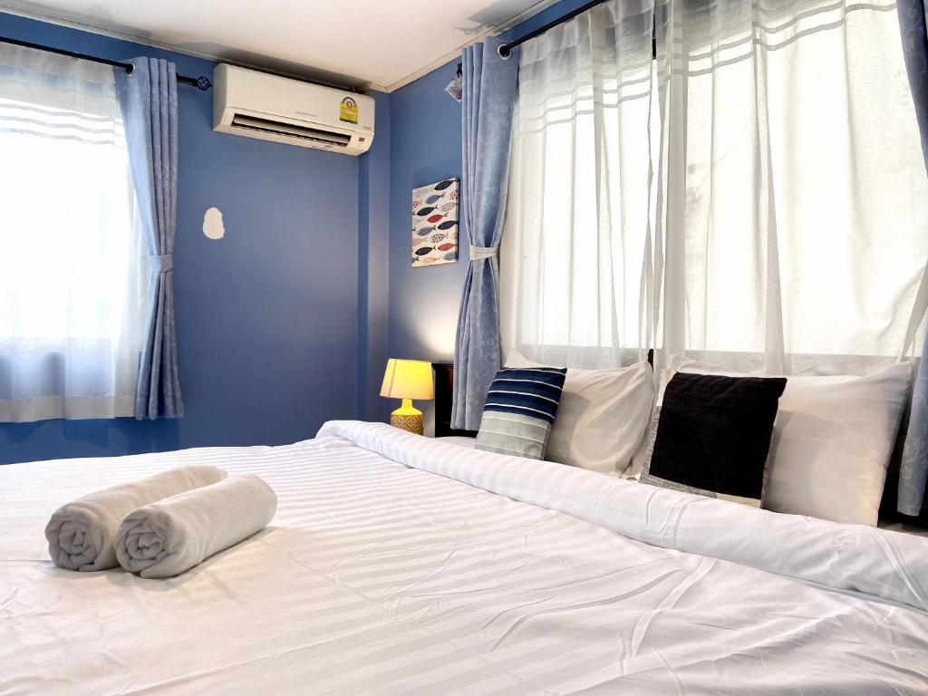 Postel nebo postele na pokoji v ubytování Minotel Patong