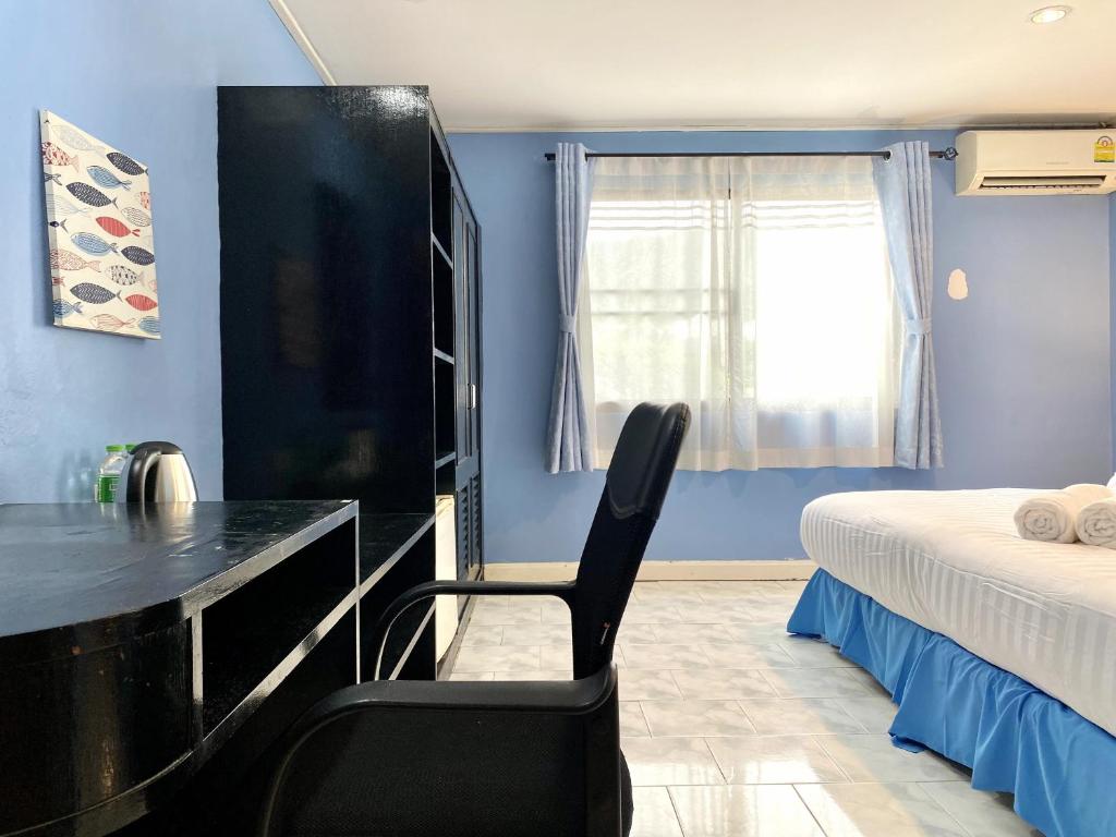 Postel nebo postele na pokoji v ubytování Minotel Patong