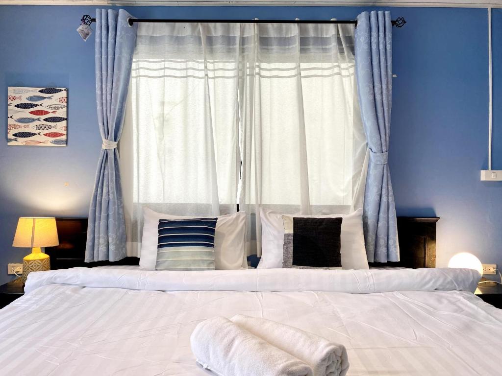 Postel nebo postele na pokoji v ubytování Minotel Patong