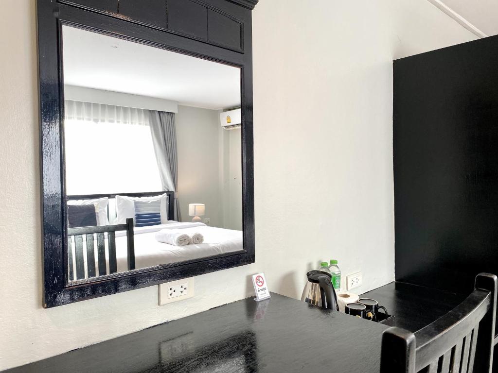 Postel nebo postele na pokoji v ubytování Minotel Patong