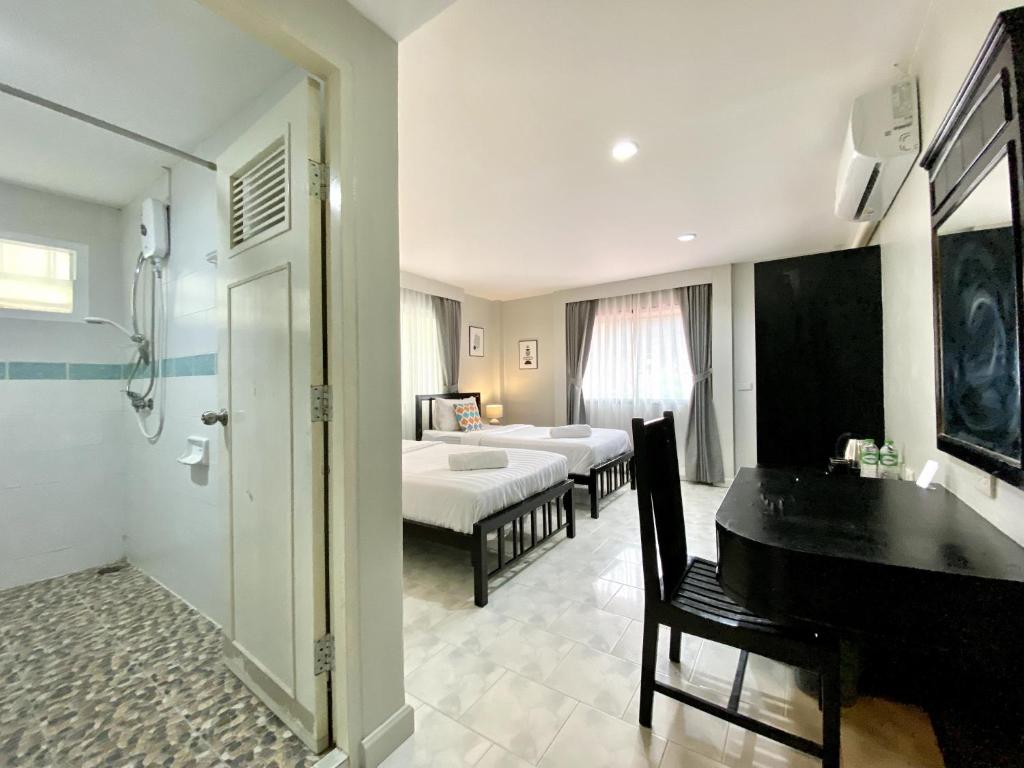 Postel nebo postele na pokoji v ubytování Minotel Patong