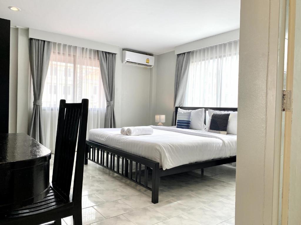 Postel nebo postele na pokoji v ubytování Minotel Patong