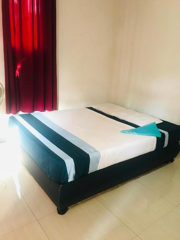 Postel nebo postele na pokoji v ubytování Hotel Deshapriya
