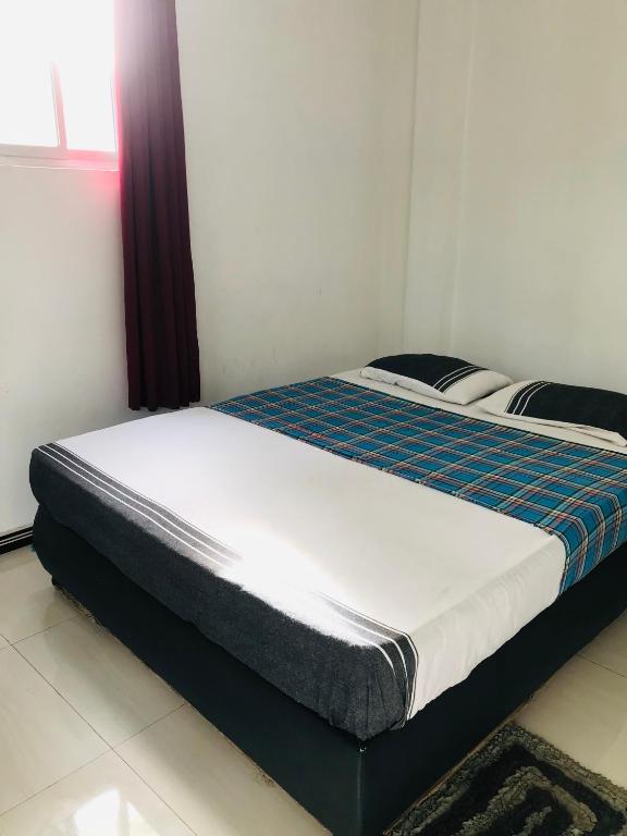 Postel nebo postele na pokoji v ubytování Hotel Deshapriya