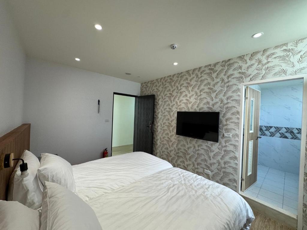 Postel nebo postele na pokoji v ubytování Yongshanshui B&B