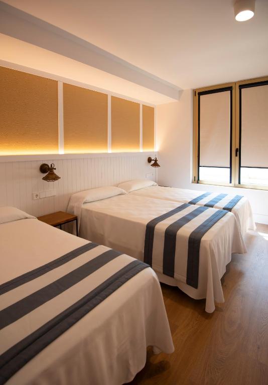 Postel nebo postele na pokoji v ubytování Hotel Els Pins