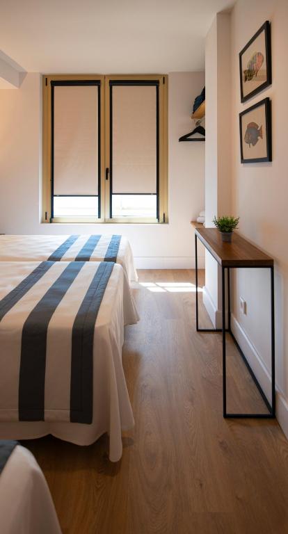 Postel nebo postele na pokoji v ubytování Hotel Els Pins