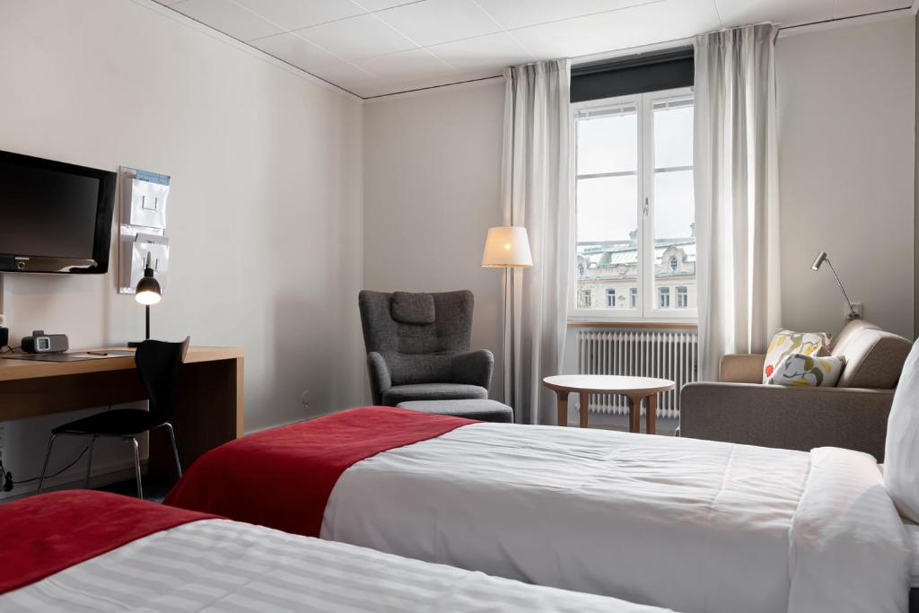Postel nebo postele na pokoji v ubytování Hotel Bishops Arms Strängnäs