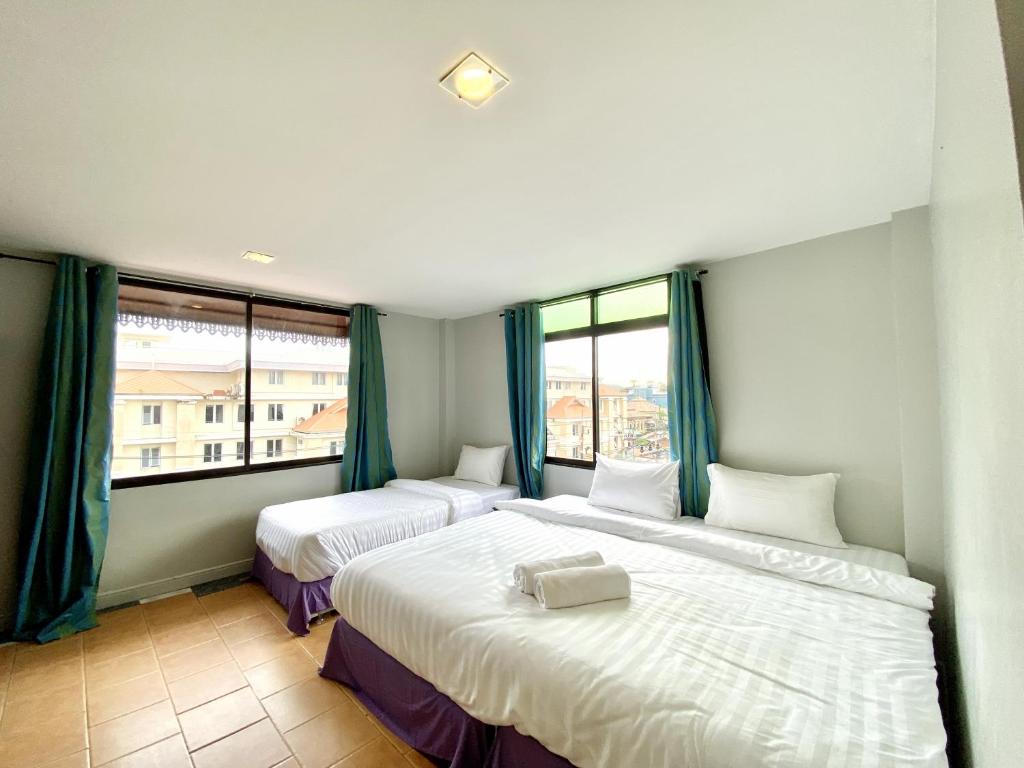 Postel nebo postele na pokoji v ubytování Minotel Patong