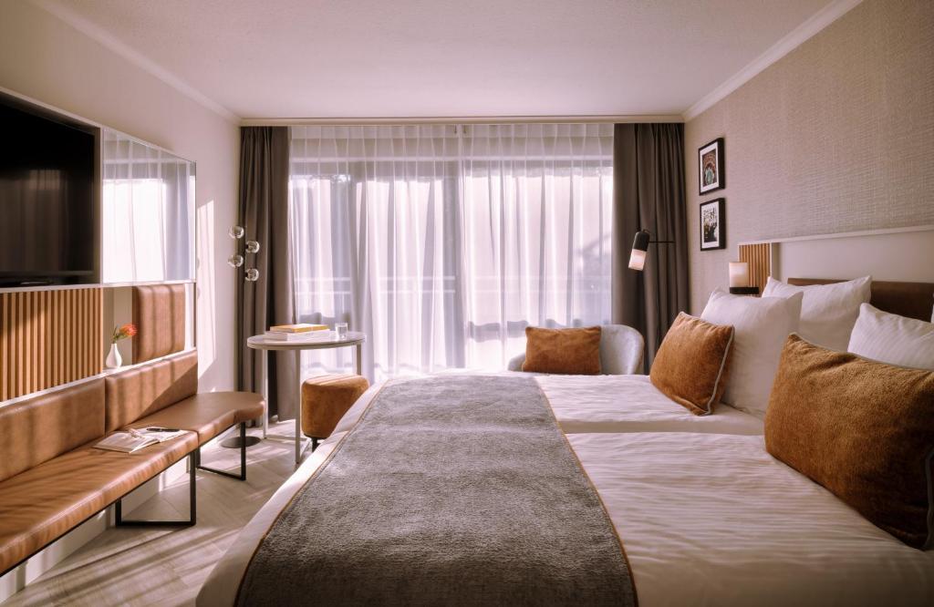 Postel nebo postele na pokoji v ubytování Leonardo Royal Hotel Baden- Baden