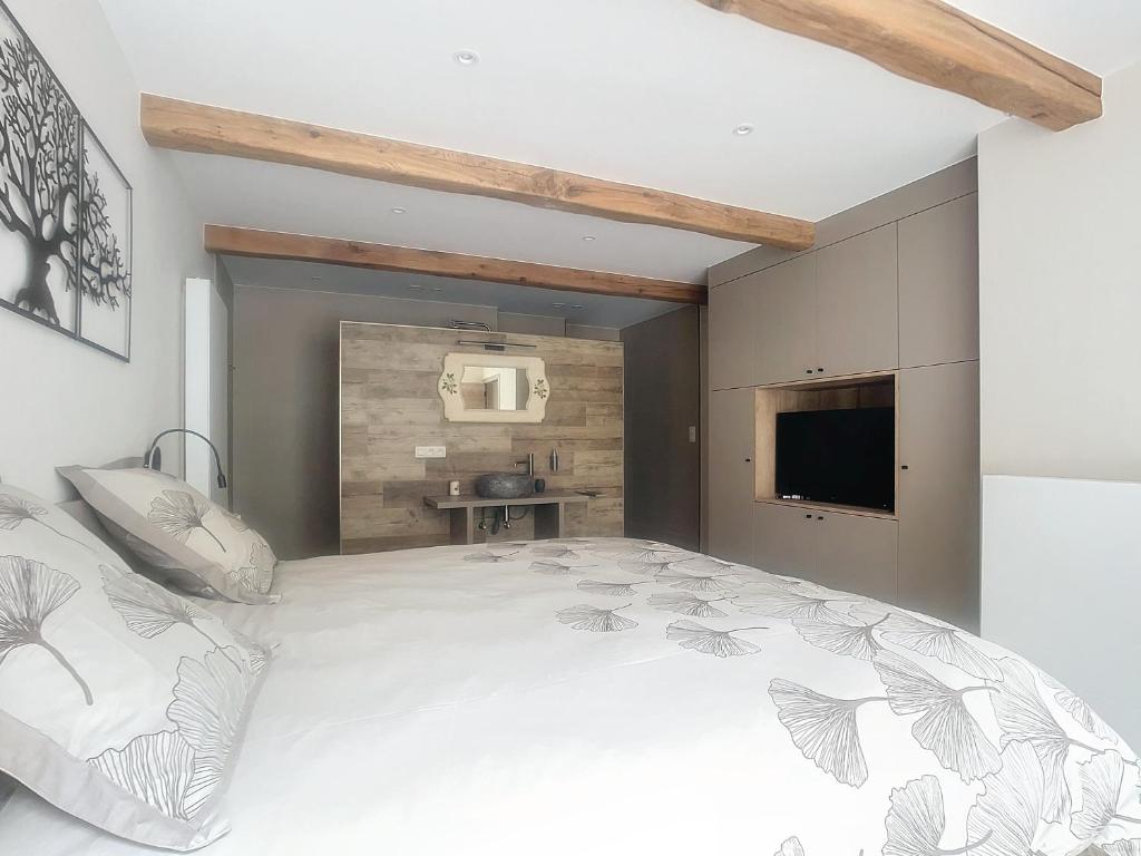 Postel nebo postele na pokoji v ubytování Gîte Les Longs Prés