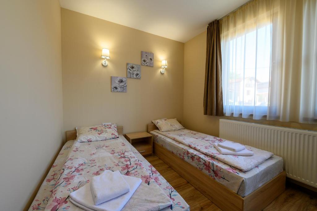 Postel nebo postele na pokoji v ubytování Rila Hills