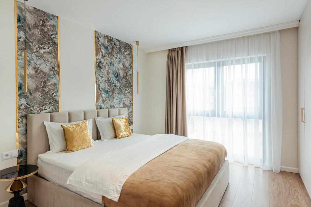 Postel nebo postele na pokoji v ubytování AWA Residence