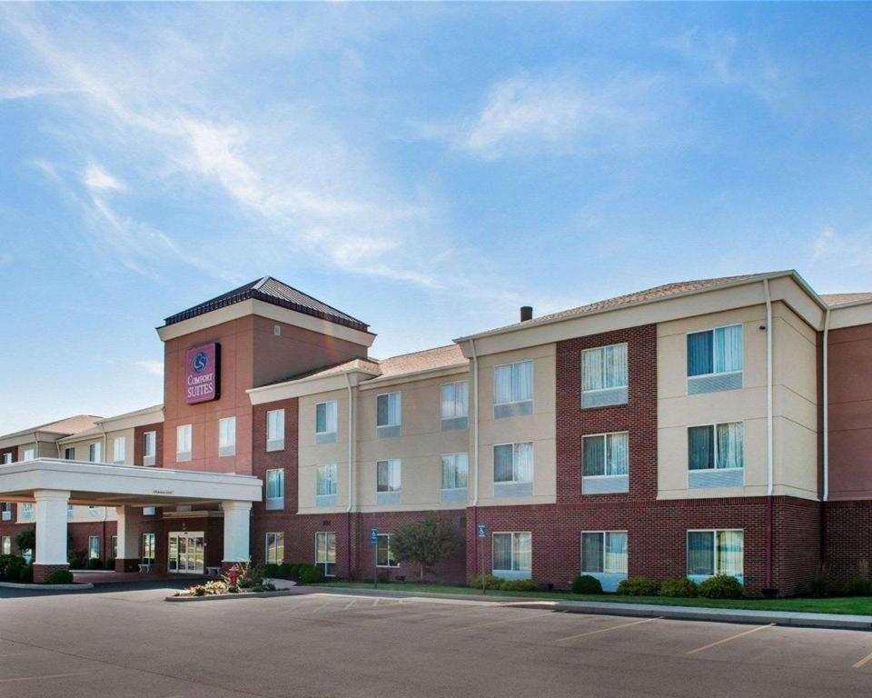 a hotel building with a parking lot in front of it at Comfort Suites in French Lick