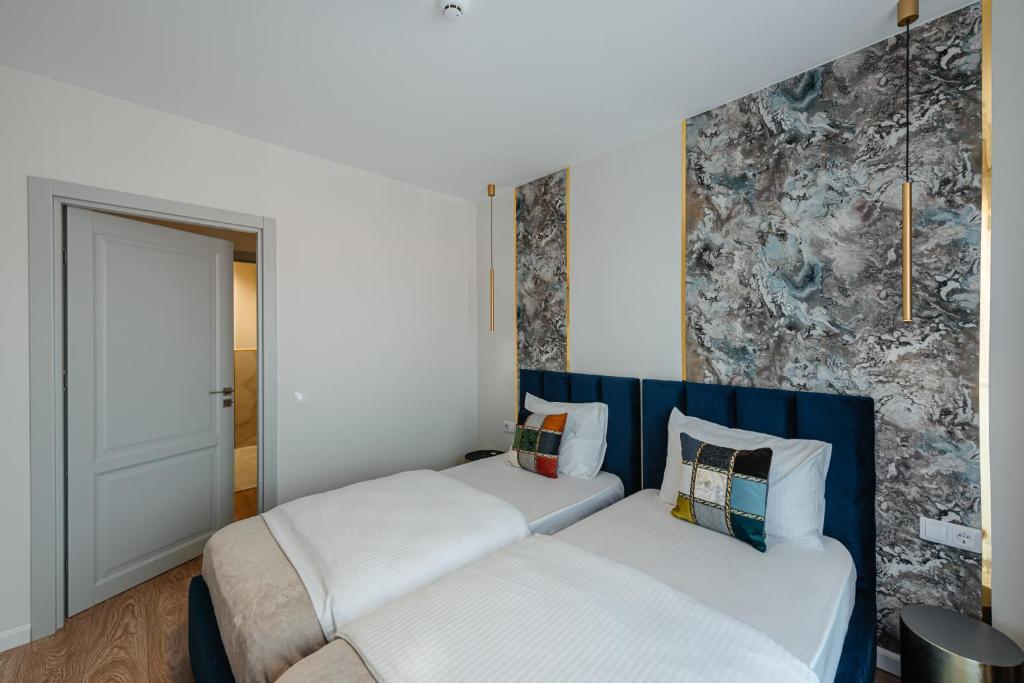 Postel nebo postele na pokoji v ubytování AWA Residence