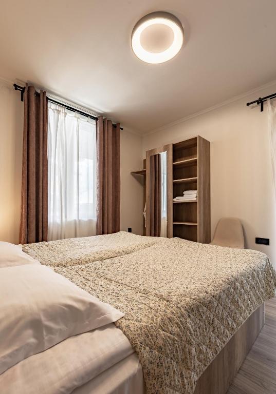 Postel nebo postele na pokoji v ubytování La Maison Mestia