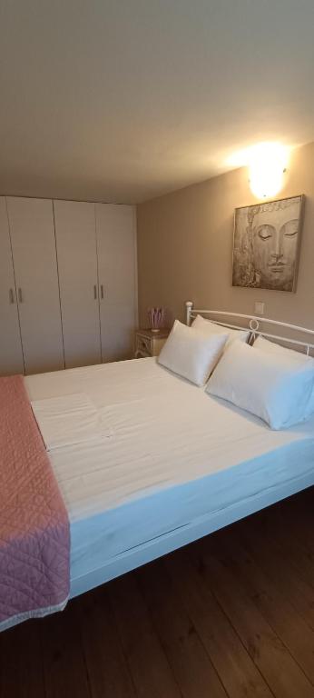 A bed or beds in a room at Arhontiko Katerina Spili