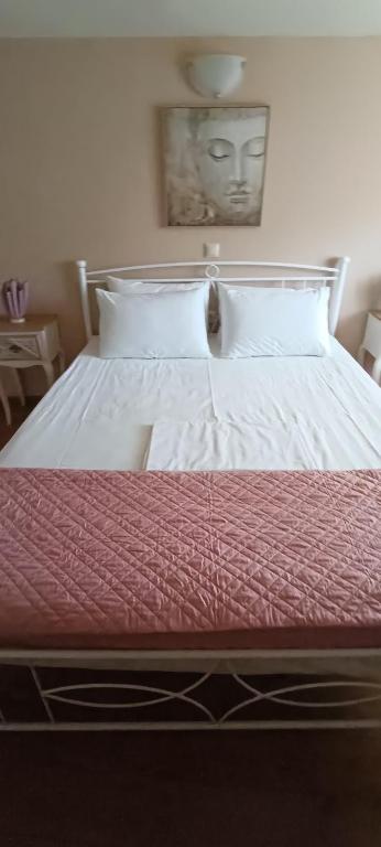A bed or beds in a room at Arhontiko Katerina Spili