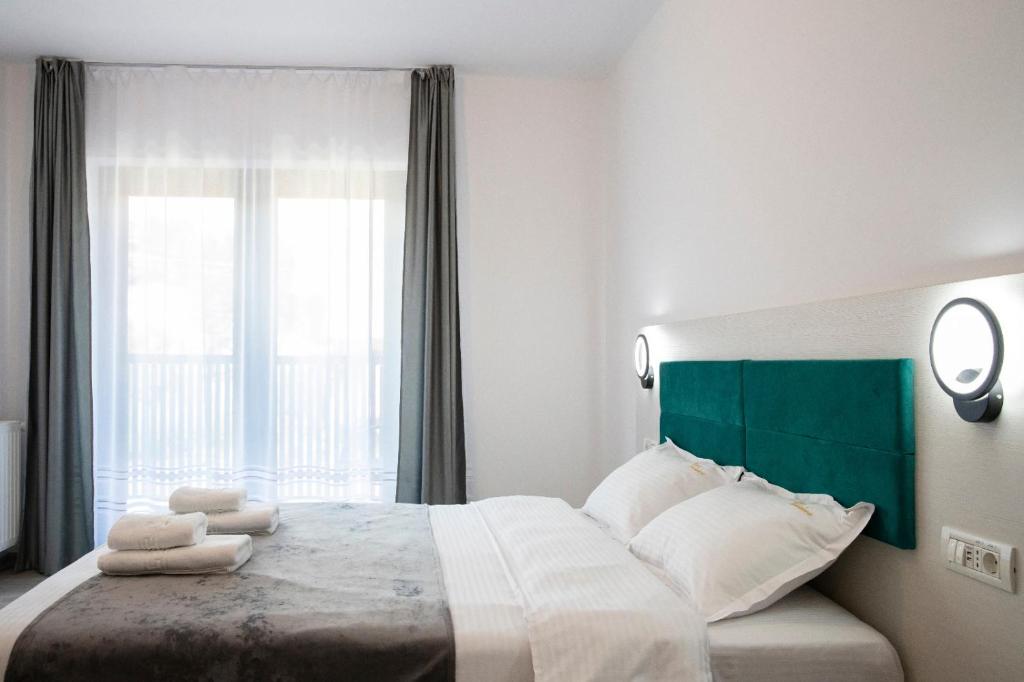 Postel nebo postele na pokoji v ubytování Casa Orhideea