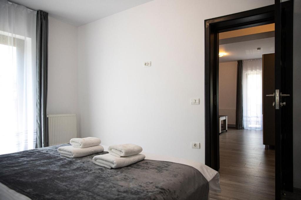 Postel nebo postele na pokoji v ubytování Casa Orhideea