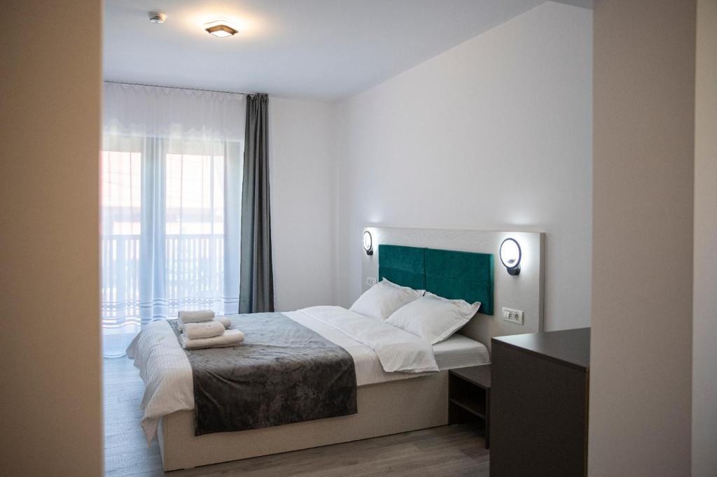 Postel nebo postele na pokoji v ubytování Casa Orhideea